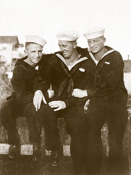 The rounded “club collar” and the high cut vest are typical of 1915-1920 Edwardian men’s fashion.<br />
The close postures of these two men suggest something more than mere friendship.